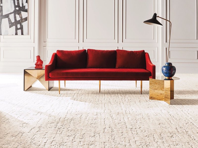 red sofa on beige carpet from Carter Carpets & Vinyl in Temperance, MI