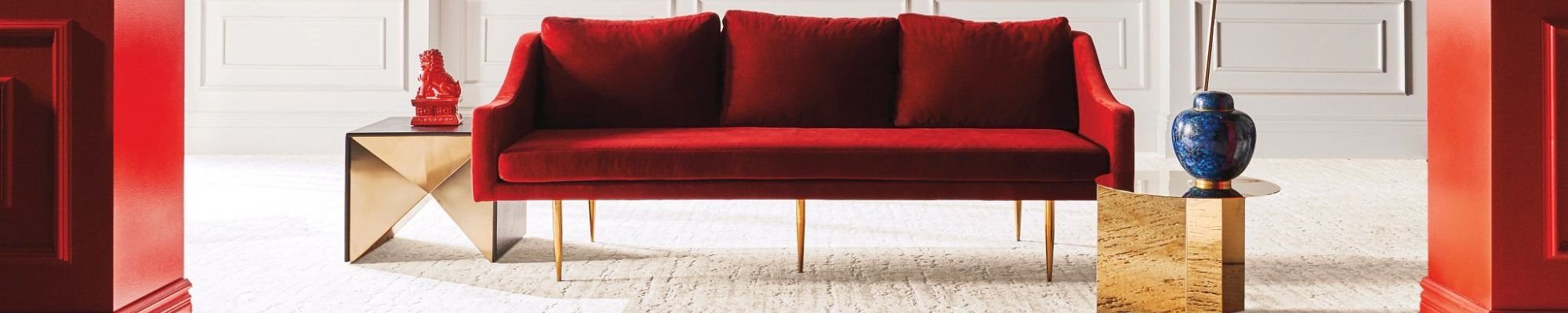 red couch on beige carpet from Carter Carpets & Vinyl in Temperance, MI